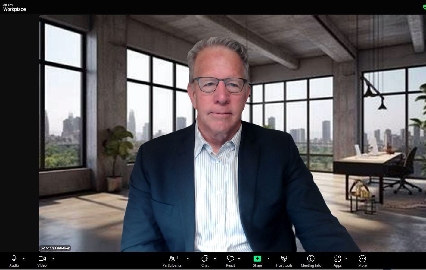 After: crisp lighting and a polished virtual background on a Teams call.